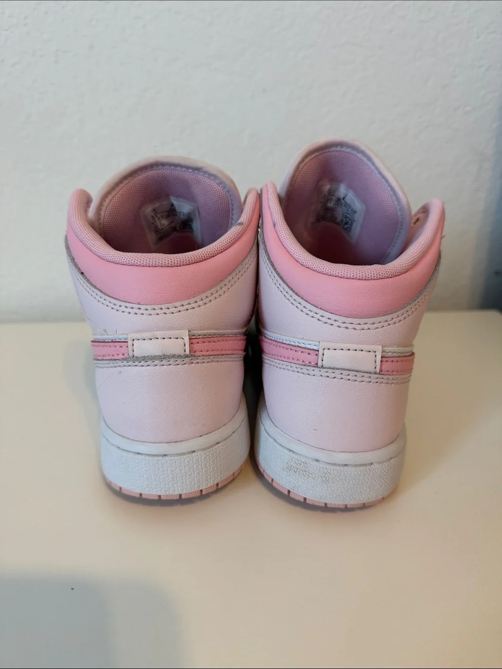 Nike Air Jordan Kids Pink and White High-Top Sneakers with Pink Swoosh